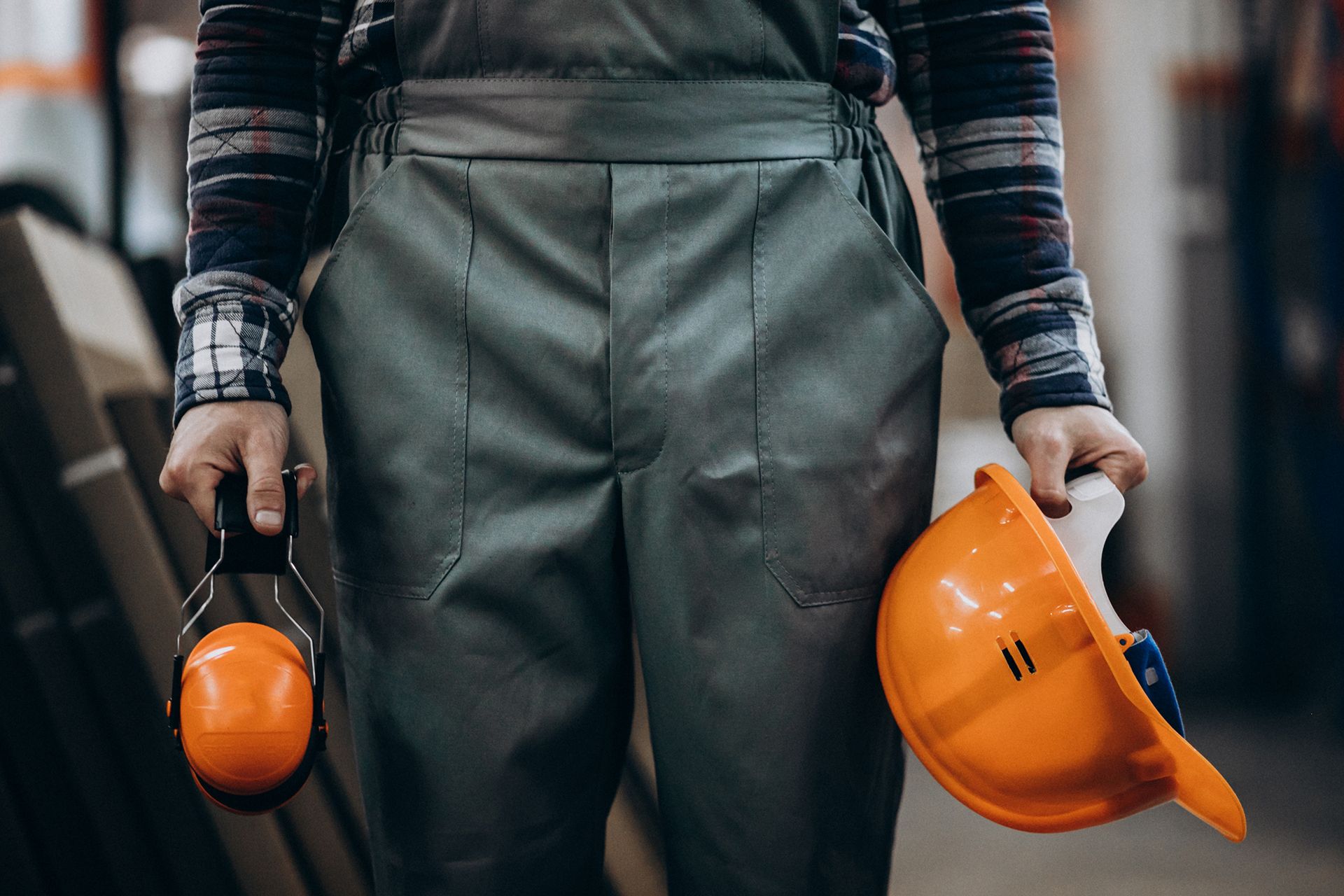 young-male-handyman-with-safety-earphones